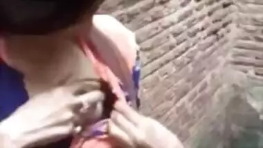 Adorable Desi cutie flashes curious friend her XXX tits in public