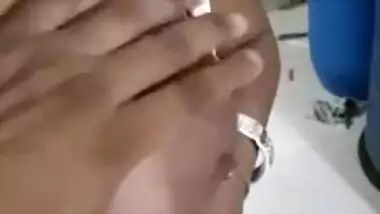 XXX-shaped boobs of slutty Indian are taken out and touched by man